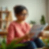 A thoughtful mother reviewing financial documents at home.